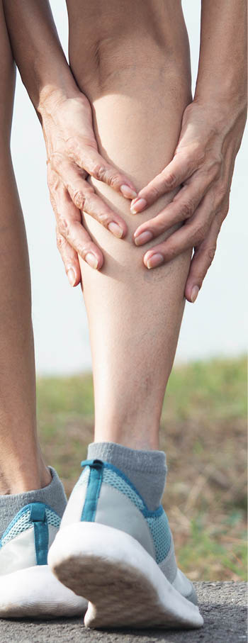 The female clings to a bad leg  The pain in her leg  Health and painful concept 